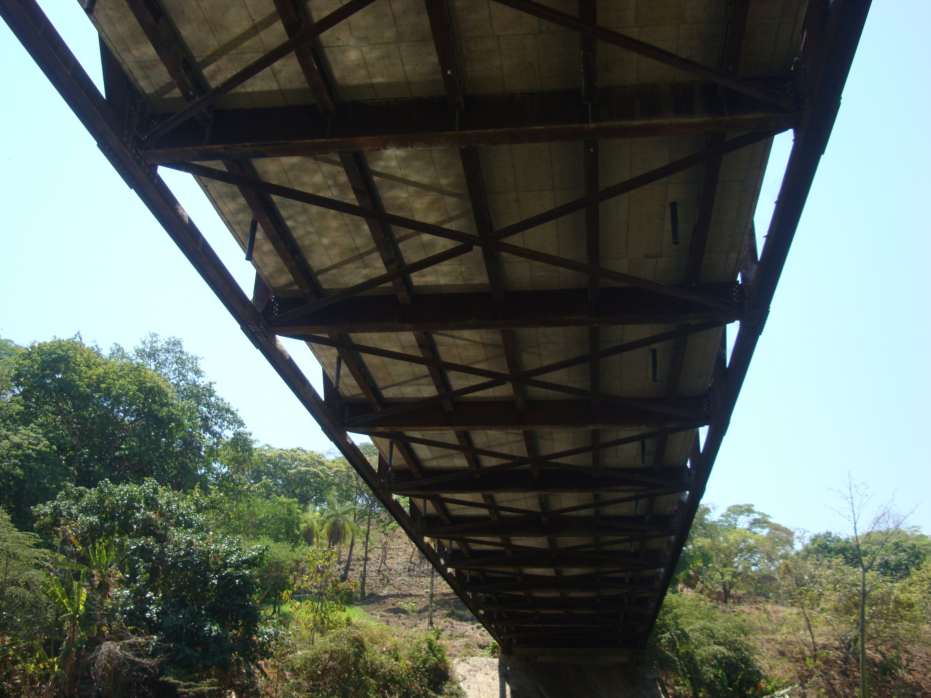Steel truss bridge seen from below
