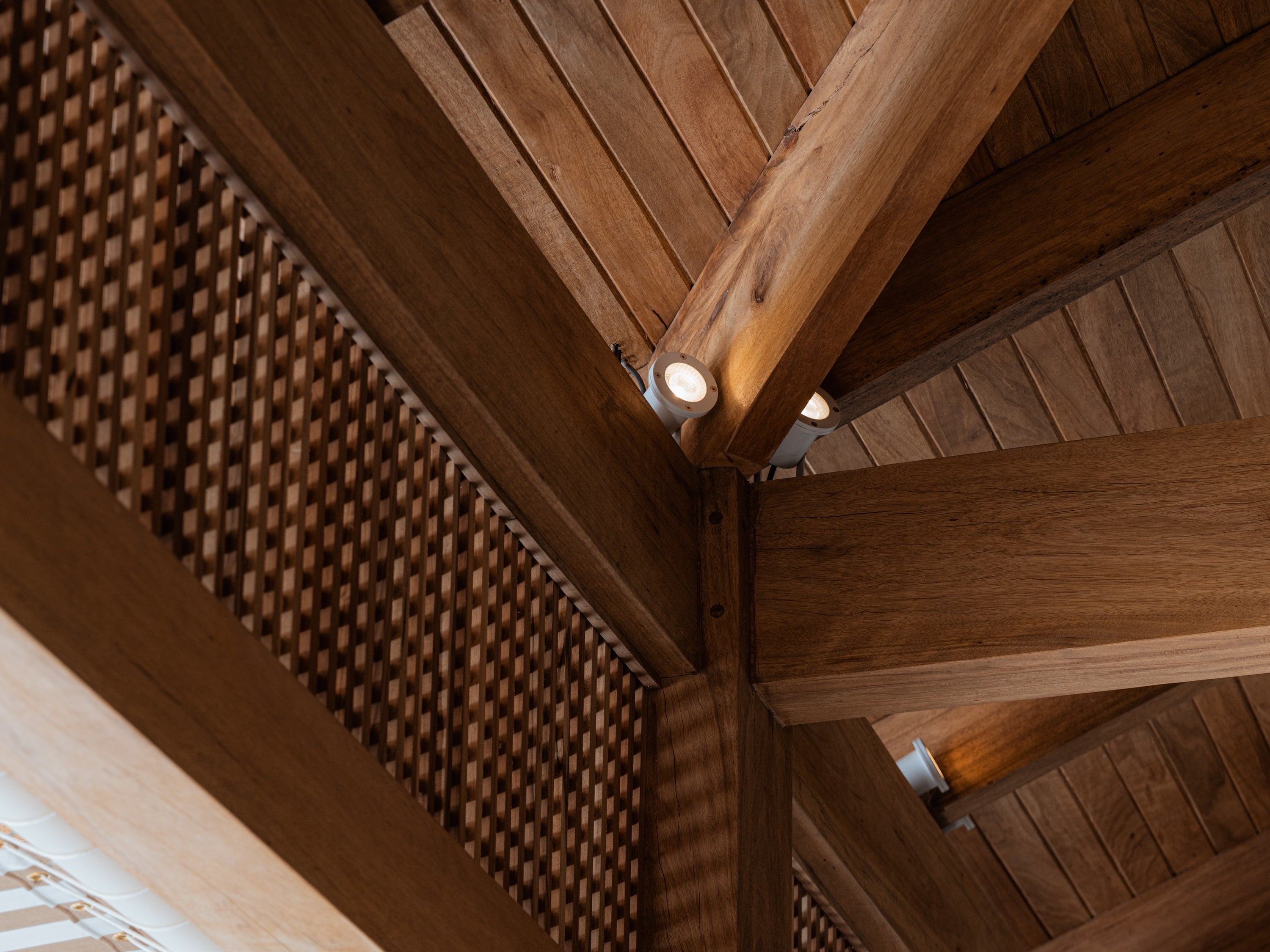 Timber beams and post under a board ceiling